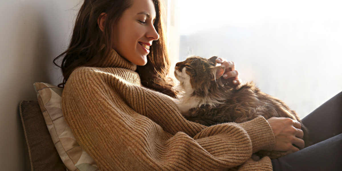 lady cuddling cat