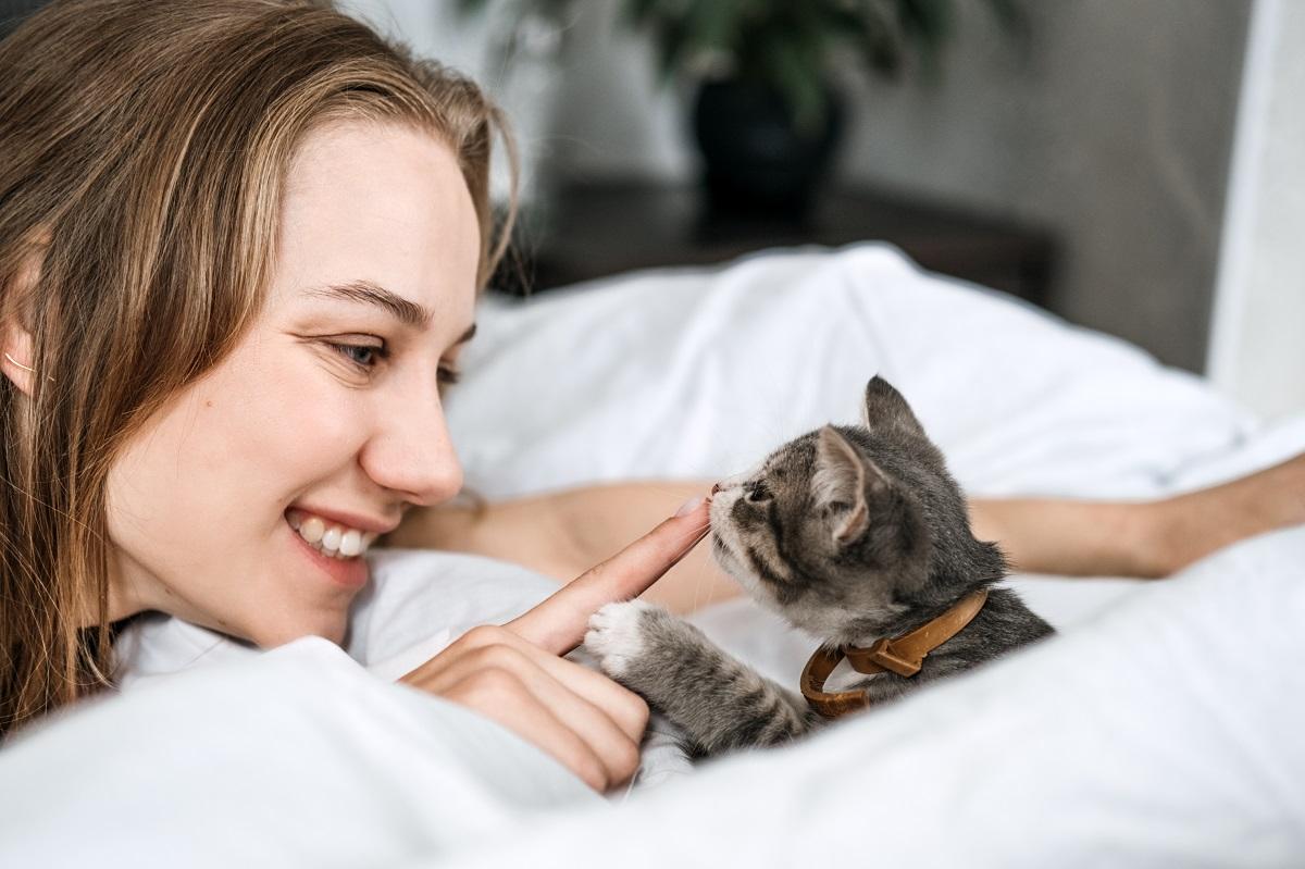 woman with young kitten